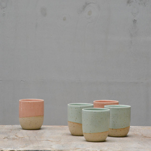 pastel color and speckled clay cups