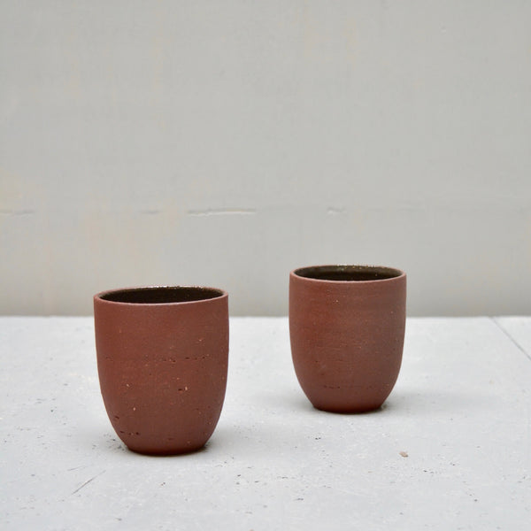 cups made of deep red stoneware clay