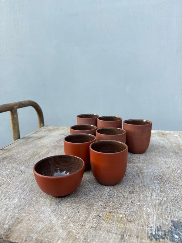 minimalistic red clay cups