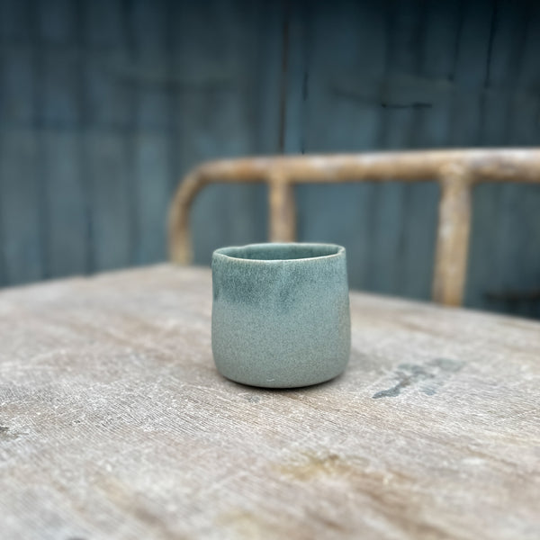 minimalistic green cup in a petal shape