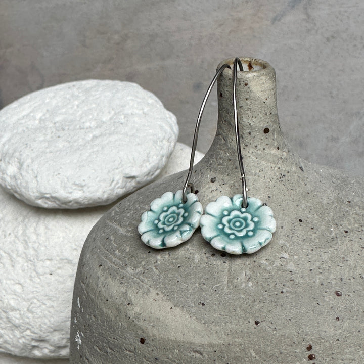 Earring - Porcelain - Fleur Du Joly on long earwires in white and jade green.