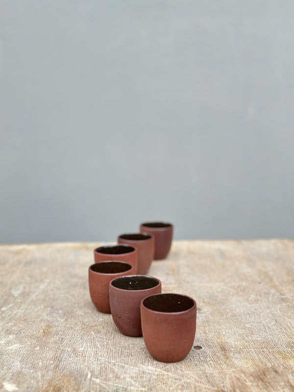 cups made of red stoneware clay